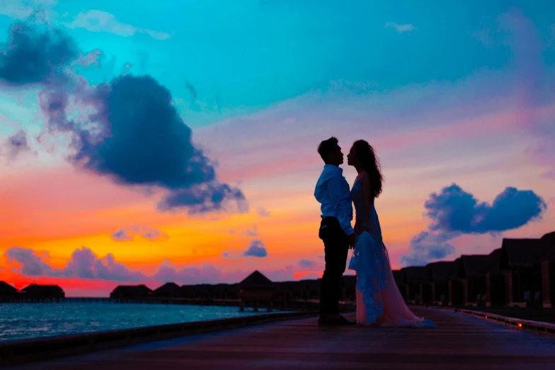 a bride and groom standing on a dock at sunset, pexels contest winner, maldives in background, avatar image, multicoloured, profile pic