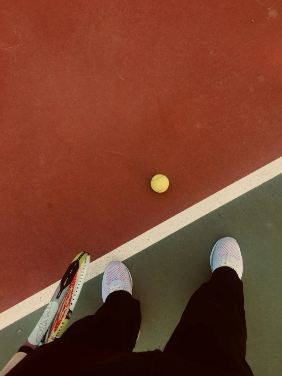 a person standing on a tennis court with a racket, some red and yellow, down there, profile image, snacks