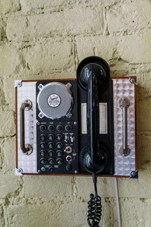 a close up of a telephone on a wall, by Sven Erixson, well decorated, technologies, panel, top - down photograph