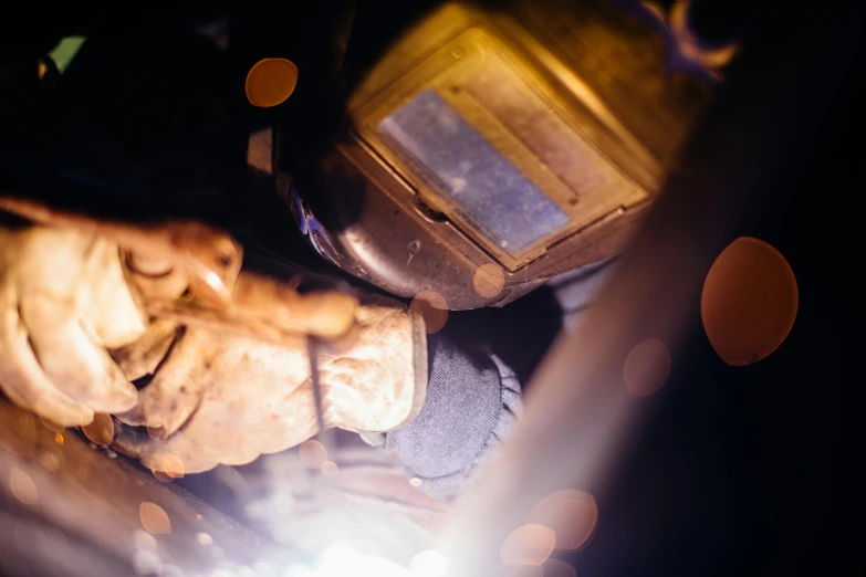 a welder working on a piece of metal, unsplash, night time, restomod, thumbnail, 35mm photo