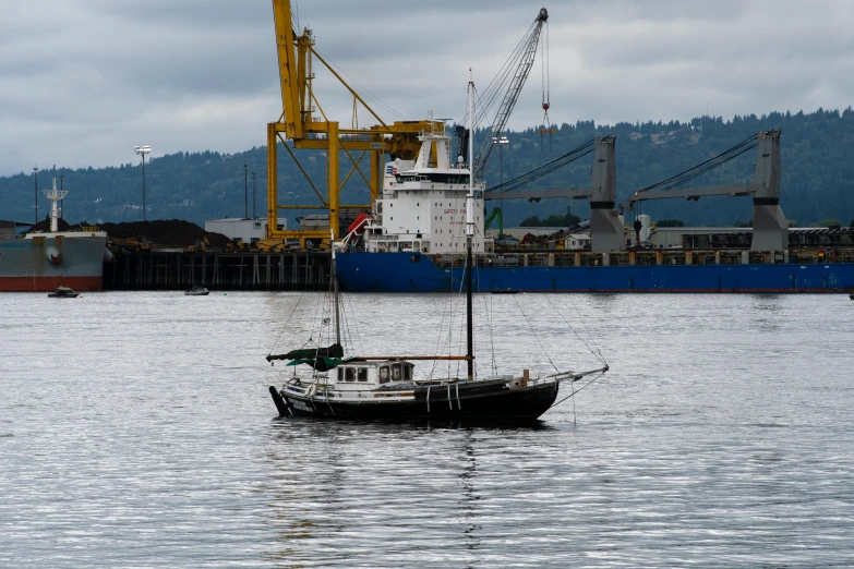 a boat floating on top of a large body of water, by Sven Erixson, pexels contest winner, shipyard, ballard, thumbnail, watch photo