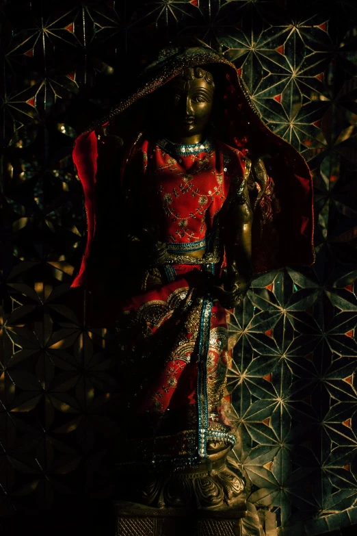 a statue of a woman in a red dress, inspired by Harry Clarke, unsplash, cloisonnism, futuristic marrakech, 7 0 mm. dramatic lighting, shrines, somali woman