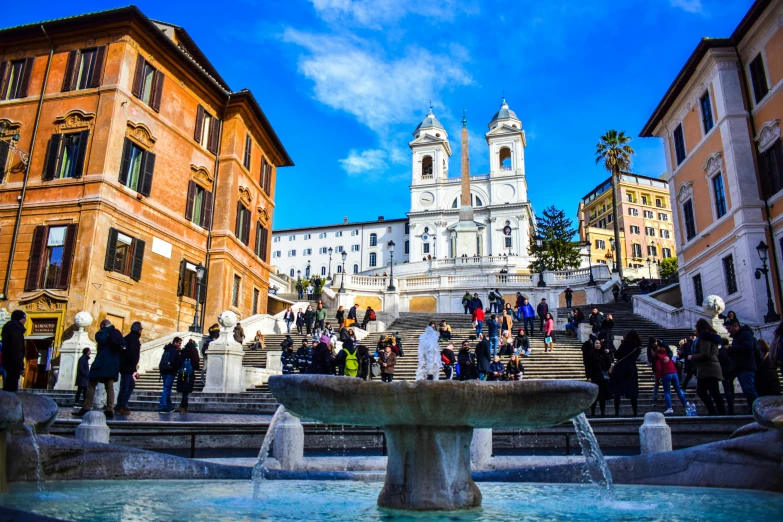 a group of people standing around a fountain, by Julia Pishtar, pexels contest winner, neoclassicism, italian mediterranean city, steps, square, on a bright day