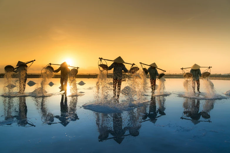 a group of people standing on top of a body of water, by Han Gan, pexels contest winner, rice, full morning sun, avatar image, seasonal