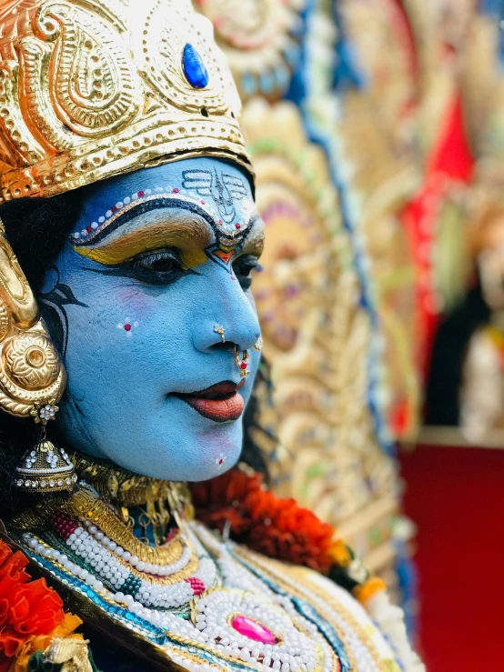 a close up of a statue of a woman, pexels contest winner, bengal school of art, blue colored traditional wear, from ramayan, in the center of the image, druillet colorful