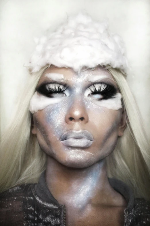 a close up of a person with makeup, an album cover, inspired by hajime sorayama, massurrealism, inuit, grey aliens, icy, drag