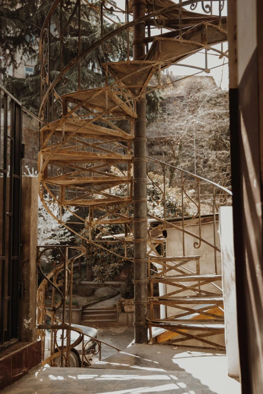 a staircase going up the side of a building, inspired by Peter Zumthor, unsplash, process art, japanese onsen, winding branches, under construction, low quality photo