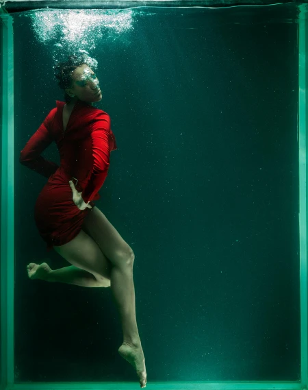 a woman in a red dress is underwater, inspired by Elsa Bleda, ashteroth, adult swim, trending photo, queen in a glass prison