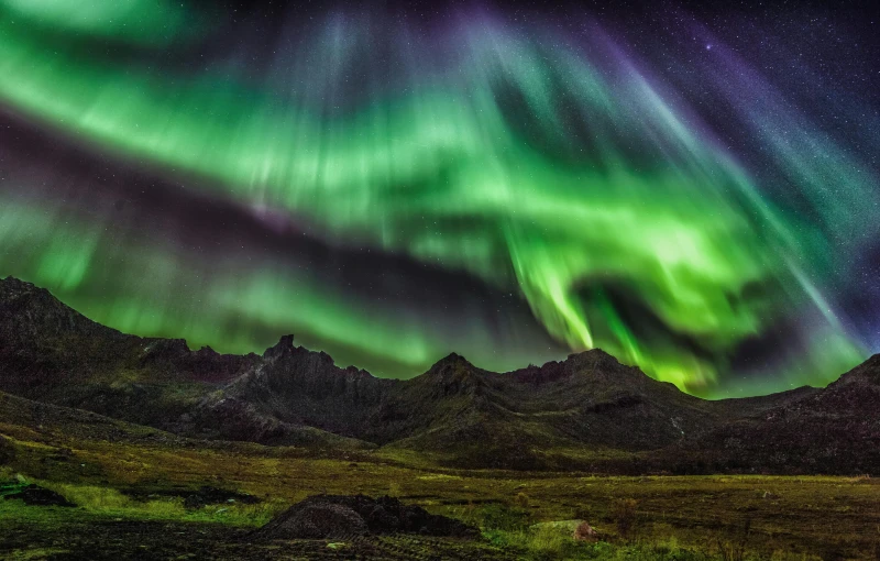 the aurora lights in the sky above a mountain range, pexels contest winner, hurufiyya, gungnir, autumn season, 8k uhd”, national geographic ”