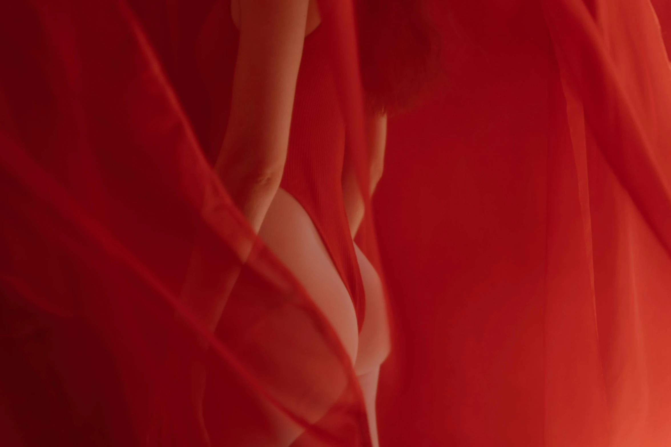 a woman standing in front of a red curtain, pexels contest winner, conceptual art, translucent body, showstudio, jessica rabbit, bottom shot