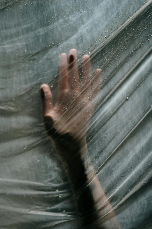 a close up of a person's hand under a sheet, inspired by Elsa Bleda, unsplash, conceptual art, glass rain, silk tarps hanging, ignant, ilustration