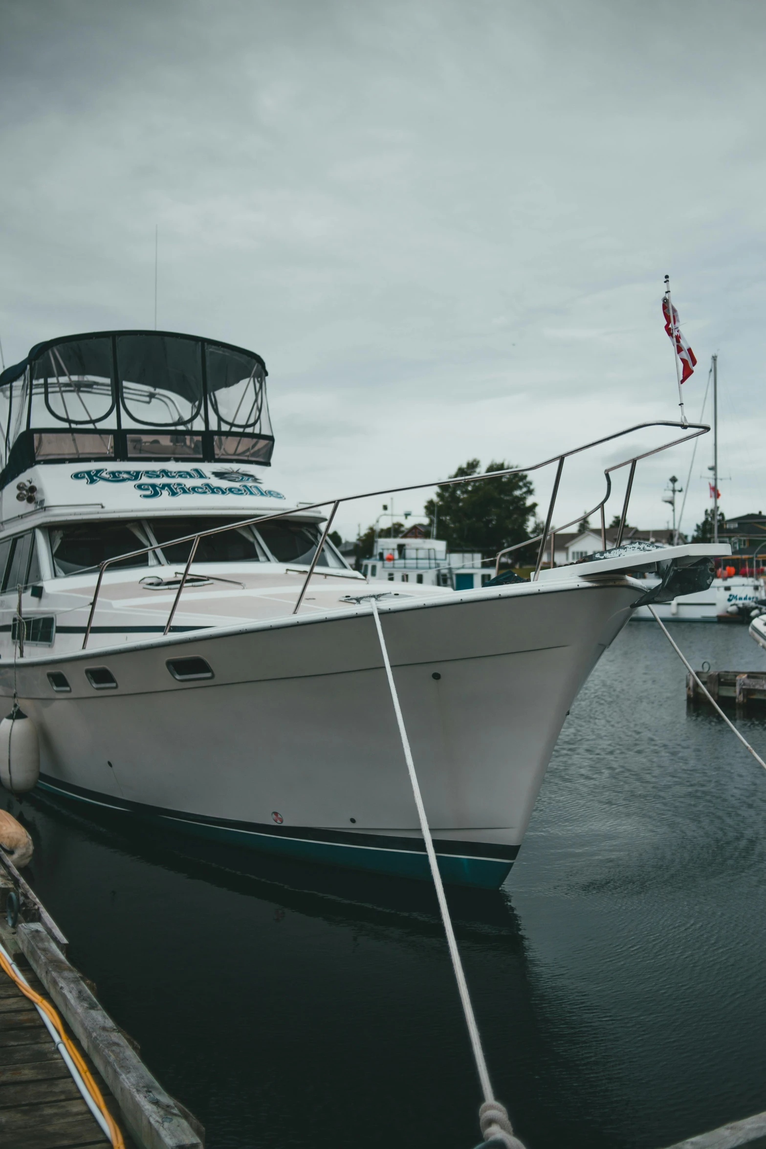 a man standing on a dock next to a boat, pexels contest winner, renaissance, picton blue, on display, on the bow, exterior wide shot