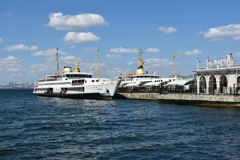 a couple of boats that are in the water, a picture, pexels contest winner, hurufiyya, fallout style istanbul, terminal, front and side views, thumbnail