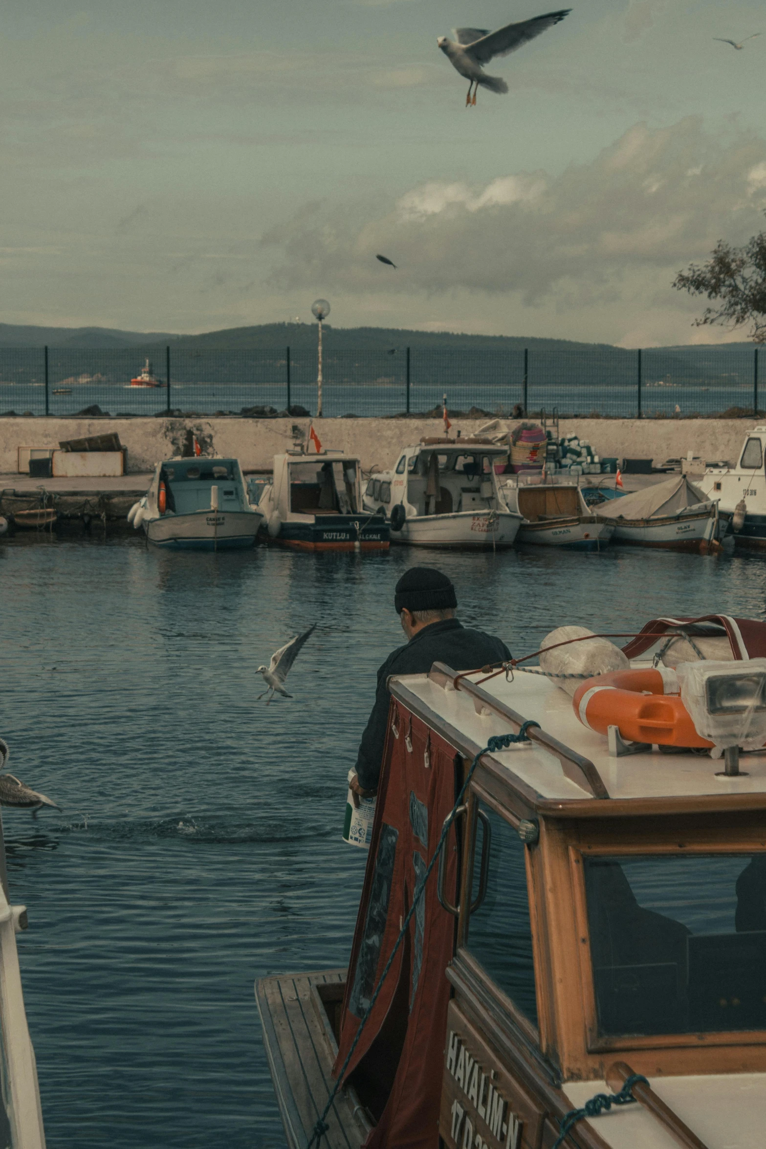 a number of boats in a body of water, a picture, pexels contest winner, happening, port scene background, sad man, turkey, hunting