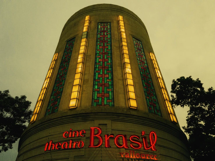 a tall building with a clock on top of it, inspired by Brassaï, art nouveau, in sao paulo, arthouse cinema, rotunda, in 2 0 0 2