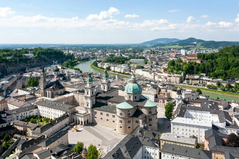 a view of a city from the top of a hill, by Breyten Breytenbach, pexels contest winner, visual art, austria, square, with great domes and arches, rivers