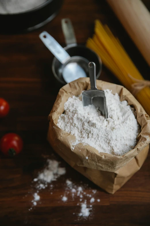 a bag of flour sitting on top of a wooden table, pexels, cutlery, thumbnail, stew, 8l