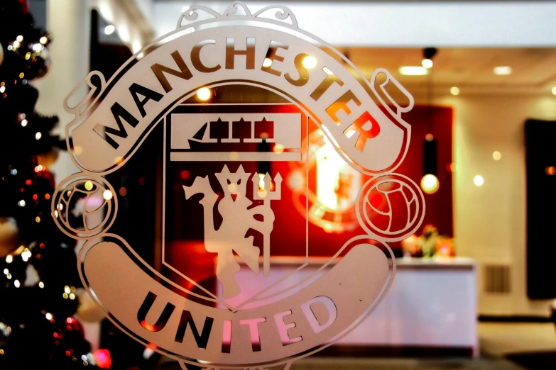 a close up of a window with a christmas tree in the background, by Thomas Scholes, liverpool football club, martial, photograph credit: ap, michelin starred restaurant