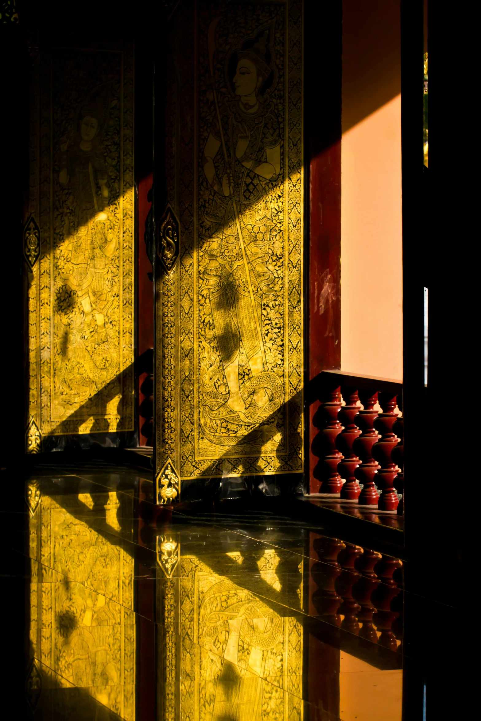 a couple of doors that are next to each other, by Dave Melvin, pexels contest winner, light and space, gold inlay, thai temple, great light and shadows”, lacquer on canvas