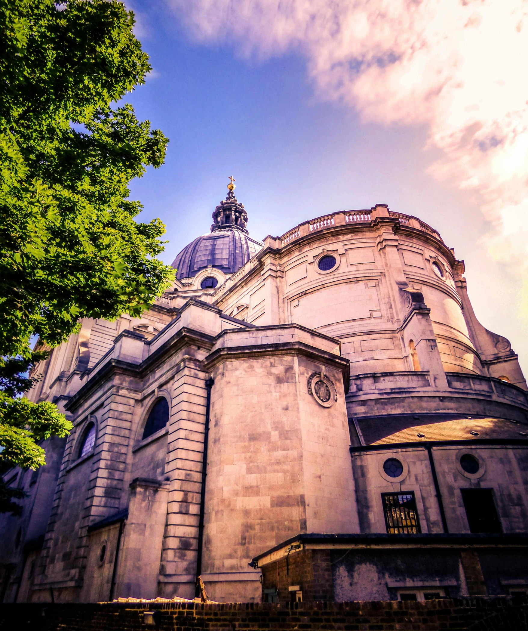 a large building with a dome on top of it, an album cover, inspired by Christopher Wren, flickr, golden hour photo, london cemetery, today\'s featured photograph 4k, exterior view