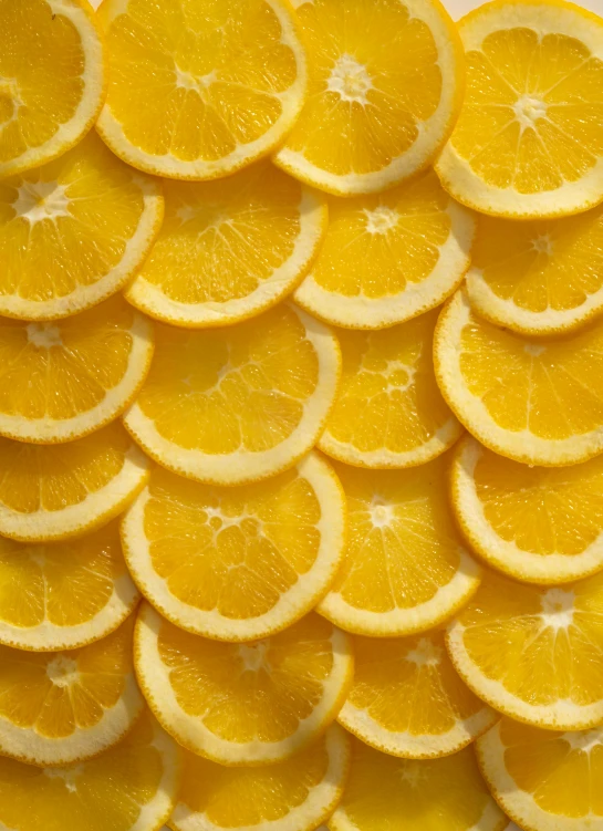 a pile of sliced oranges sitting on top of a table, light yellow, profile pic, patterned, high quality product image”