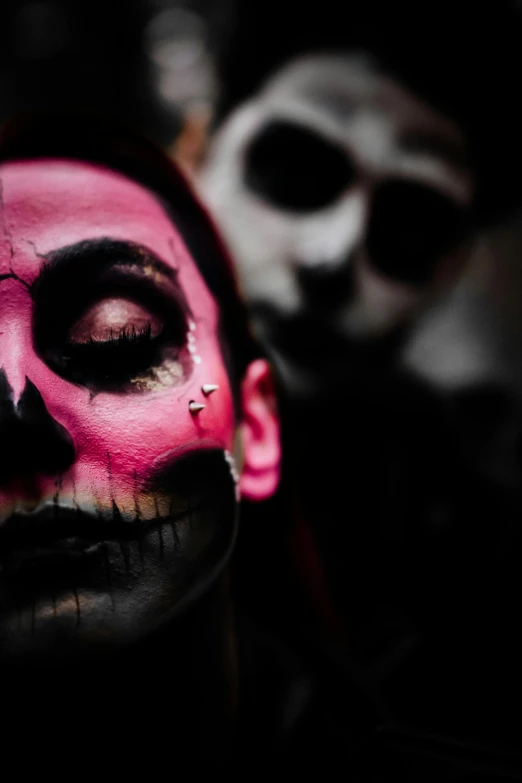 a close up of a person with a face painted, an album cover, inspired by Taro Yamamoto, pexels contest winner, skeletal figures, pink and black, ((skull)), ominous photo