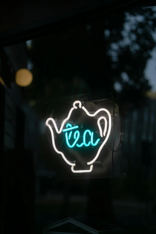 a close up of a neon sign in a window, teapot, profile image, cafe lighting, tea