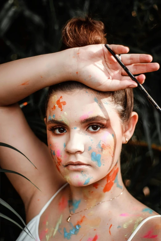 a woman with paint all over her face, a portrait, trending on pexels, natural beauty expressive pose, ilustration, cute photo, “ painting