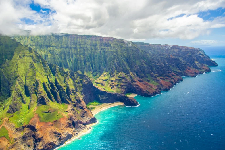 a large body of water next to a lush green hillside, ocean cliff view, flying islands, tie-dye, tropical location