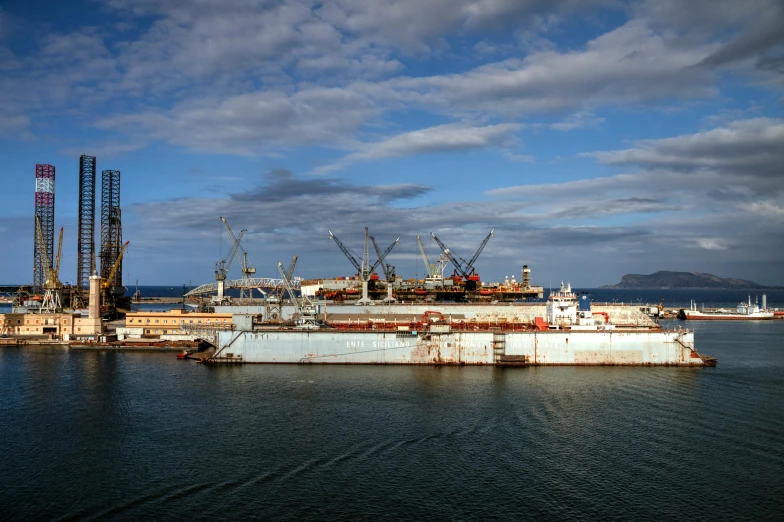 a large ship sitting in the middle of a body of water, pexels contest winner, soviet yard, chilean, joel sternfeld, partially operational