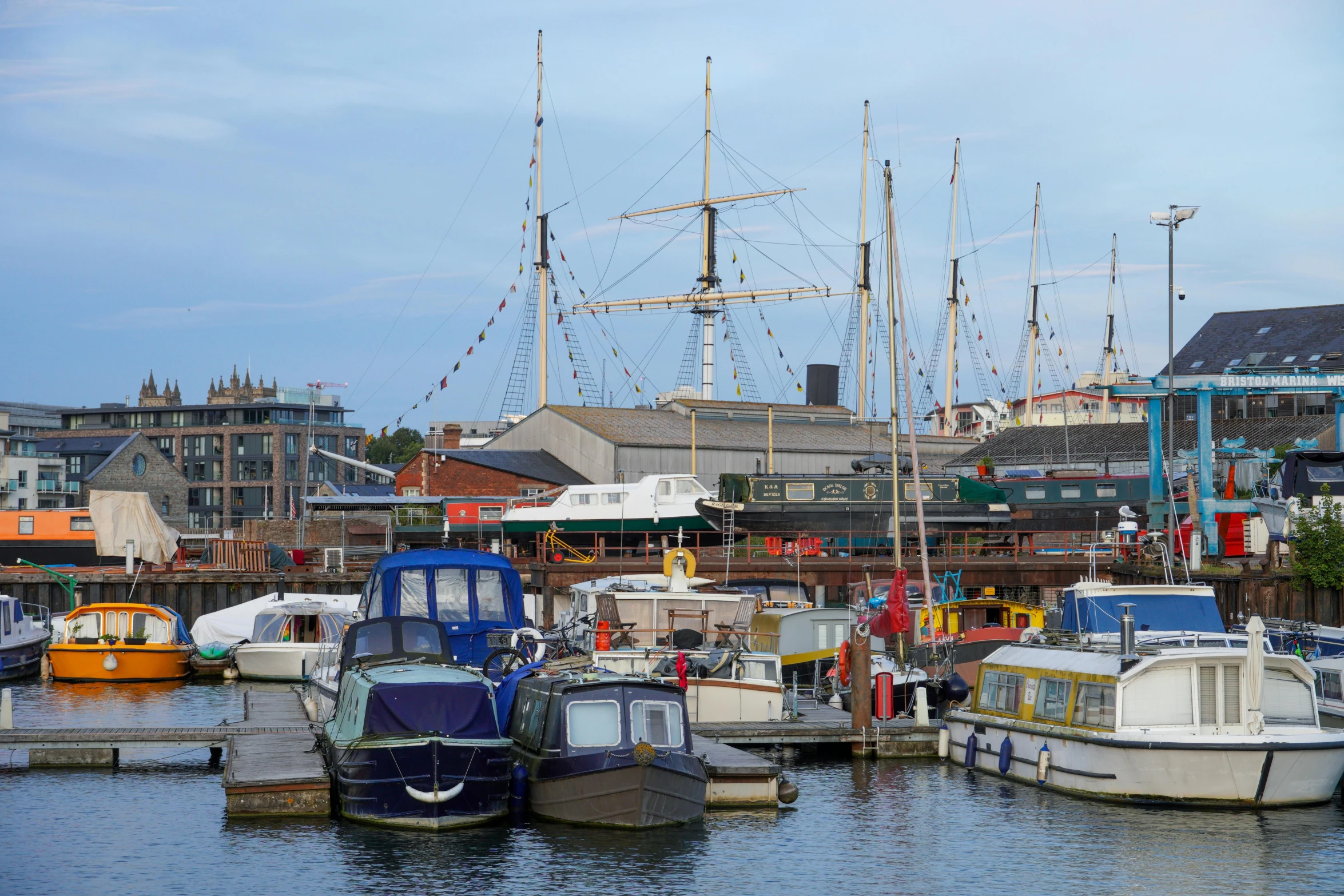 a number of boats in a body of water, by Dave Allsop, shutterstock, hull, moored, 2022 photograph