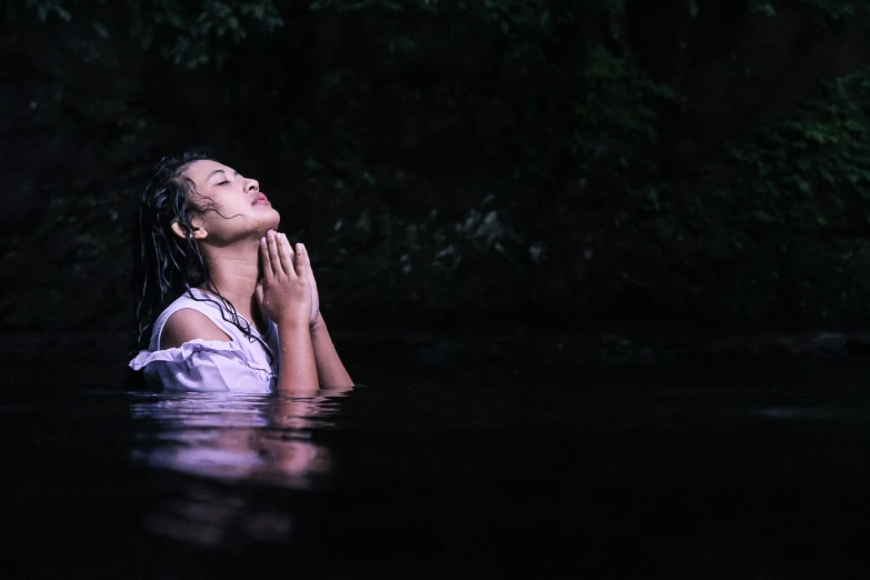 a woman standing in a body of water, holy themed, sitting down, low key, promo image