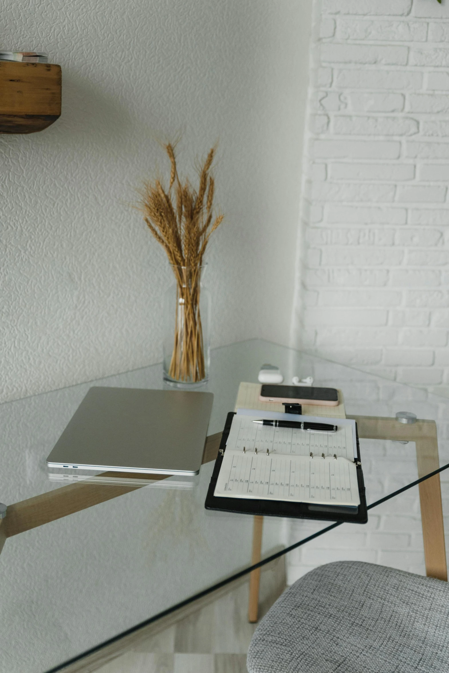 a laptop computer sitting on top of a glass desk, sustainable materials, brown, clear type, high-quality photo