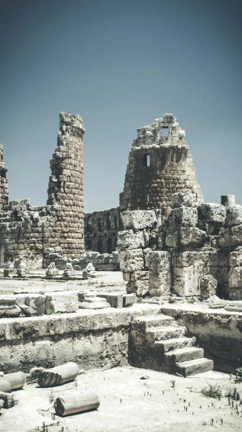 a group of ruins sitting on top of a dirt field, pexels contest winner, romanesque, square, middle eastern, vintage color, classical antiquities on display