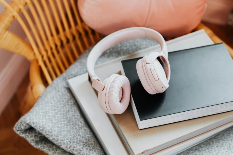 a stack of books with headphones on top of them, trending on pexels, pink accents, pink arches, a pair of ribbed, instagram post