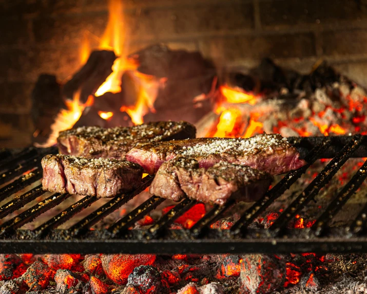 steaks cooking on a grill in front of a fire, by Daniel Lieske, pexels contest winner, renaissance, melbourne, thumbnail, background image