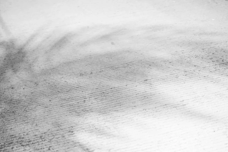 a man riding a snowboard down a snow covered slope, an abstract drawing, inspired by Ryoji Ikeda, unsplash, lyrical abstraction, detail texture, graphite on paper, moist dirty carpet, white cloth