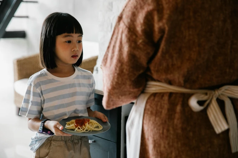 a little girl holding a plate of spaghetti, pexels contest winner, fiona staples and kinu nishimura, ( waitress ) girl, high drama, ruan jia and brom