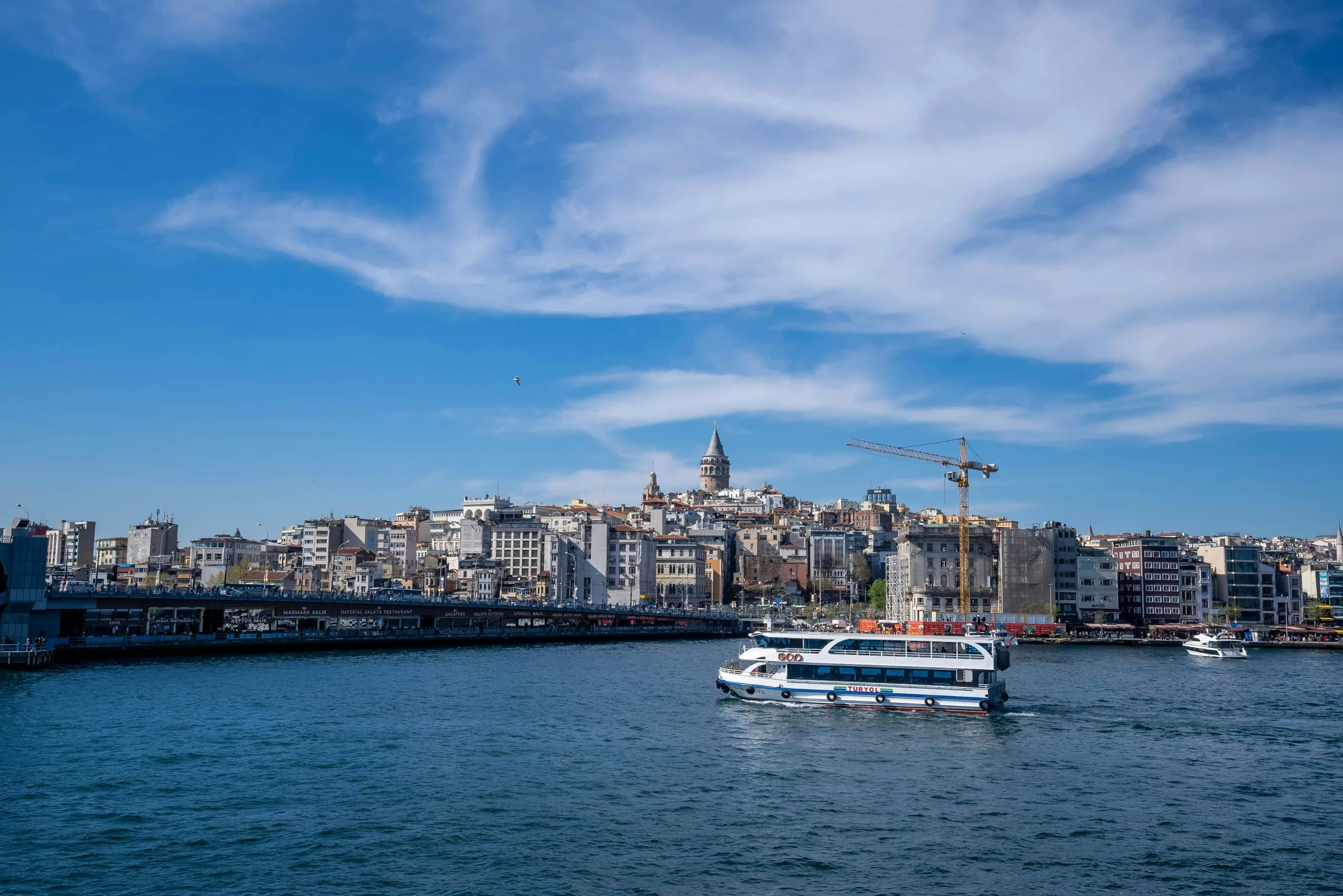 a boat in a body of water with a city in the background, a photo, pexels contest winner, hurufiyya, istanbul, clear blue skies, thumbnail, slide show