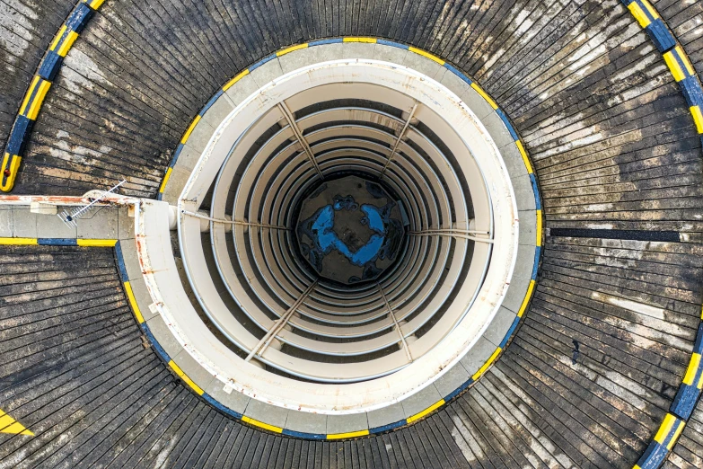 an overhead view of the inside of a building, by Matthias Stom, unsplash, nuclear art, tubular creature, gigantic tower, deep shafts, thumbnail