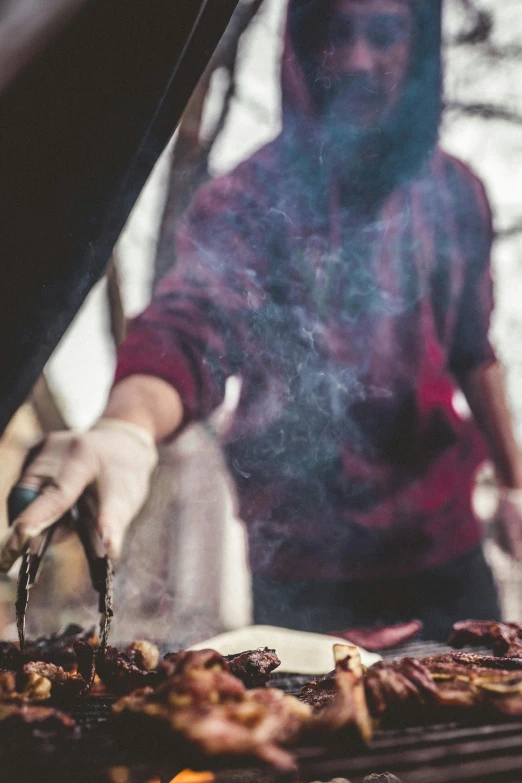 a person that is cooking some food on a grill, pexels contest winner, renaissance, maroon, maple syrup highlights, postapocalyptic vibes, detail shot