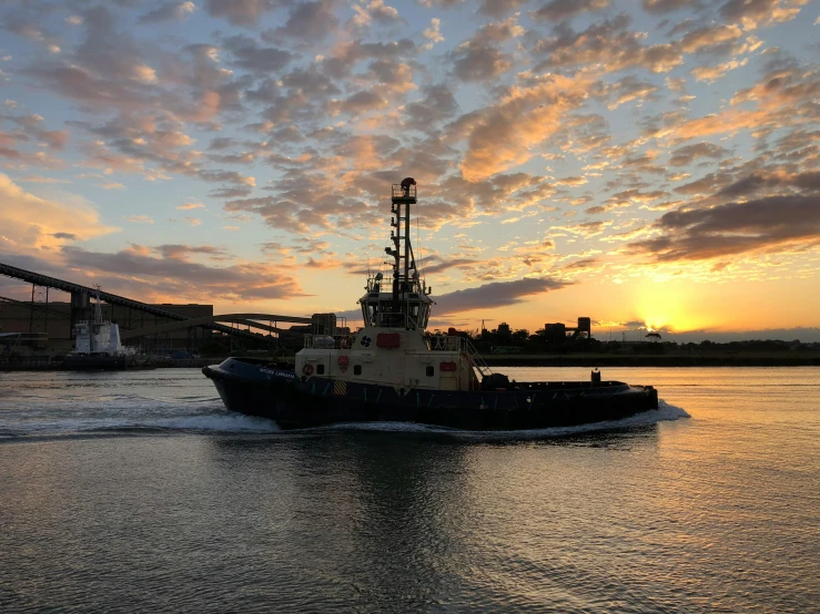 a boat in the water with a bridge in the background, pexels contest winner, figuration libre, going forward to the sunset, container ship, photo on iphone, ready to model