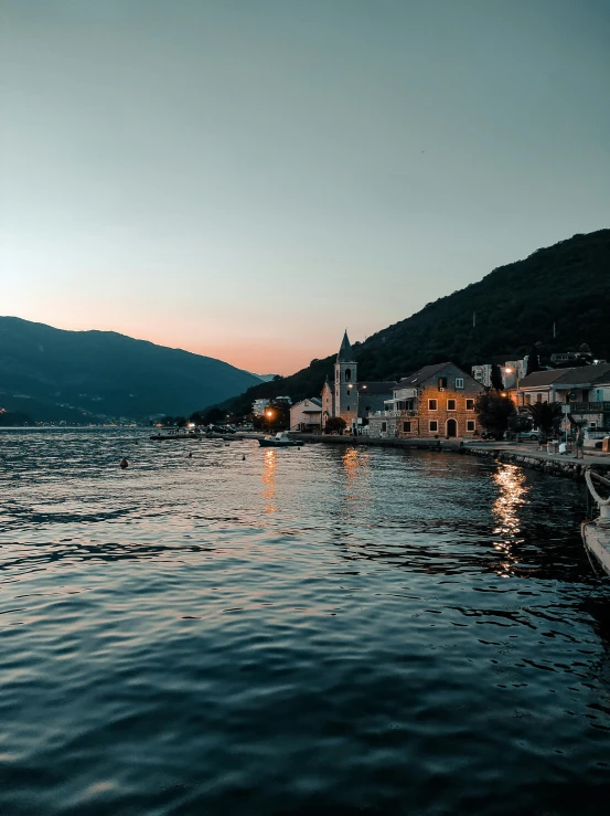 a boat floating on top of a body of water, by Julia Pishtar, pexels contest winner, croatian coastline, humid evening, boka, 2 5 6 x 2 5 6 pixels