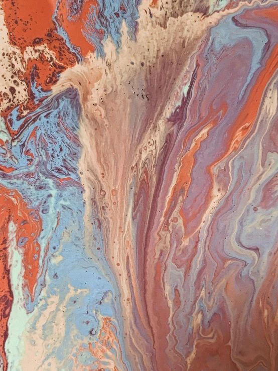 a close up of a painting on a wall, inspired by Frederic Church, trending on unsplash, sand swirling, paint pour, brown red blue, pastelwave