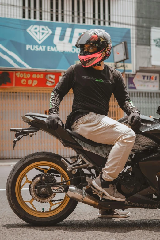 a man sitting on a motorcycle on a city street, inspired by Adam Dario Keel, pexels contest winner, renaissance, indonesia, black shirt underneath armor, at racer track, helmets