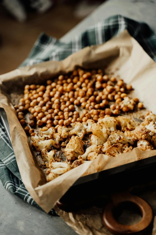 a tray of food sitting on top of a table, by Kristin Nelson, unsplash, brown flowers, bumps, crust, cooking