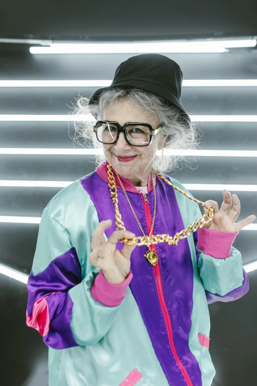 a woman standing in front of a neon light, inspired by Helen Berman, dressed as a judge's robes, wearing a bandana and chain, wearing gold glasses, wearing a track suit