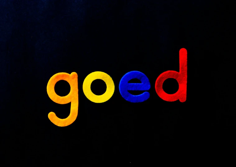 a close up of the word good on a black background, inspired by Zsolt Bodoni, pexels contest winner, neogeo, red yellow blue, made of smooth black goo, radiohead album cover, shkkeled in the voied