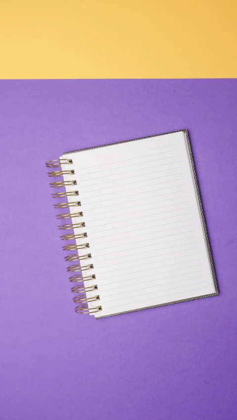 an open notebook on a purple and yellow background, by Andries Stock, shutterstock, gold foil, striped, scrapbook, f 5. 8