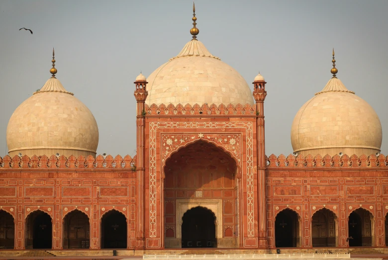 a large building with two domes on top of it, a marble sculpture, by Riza Abbasi, pexels contest winner, hurufiyya, tombs, red building, mogul khan, dezeen